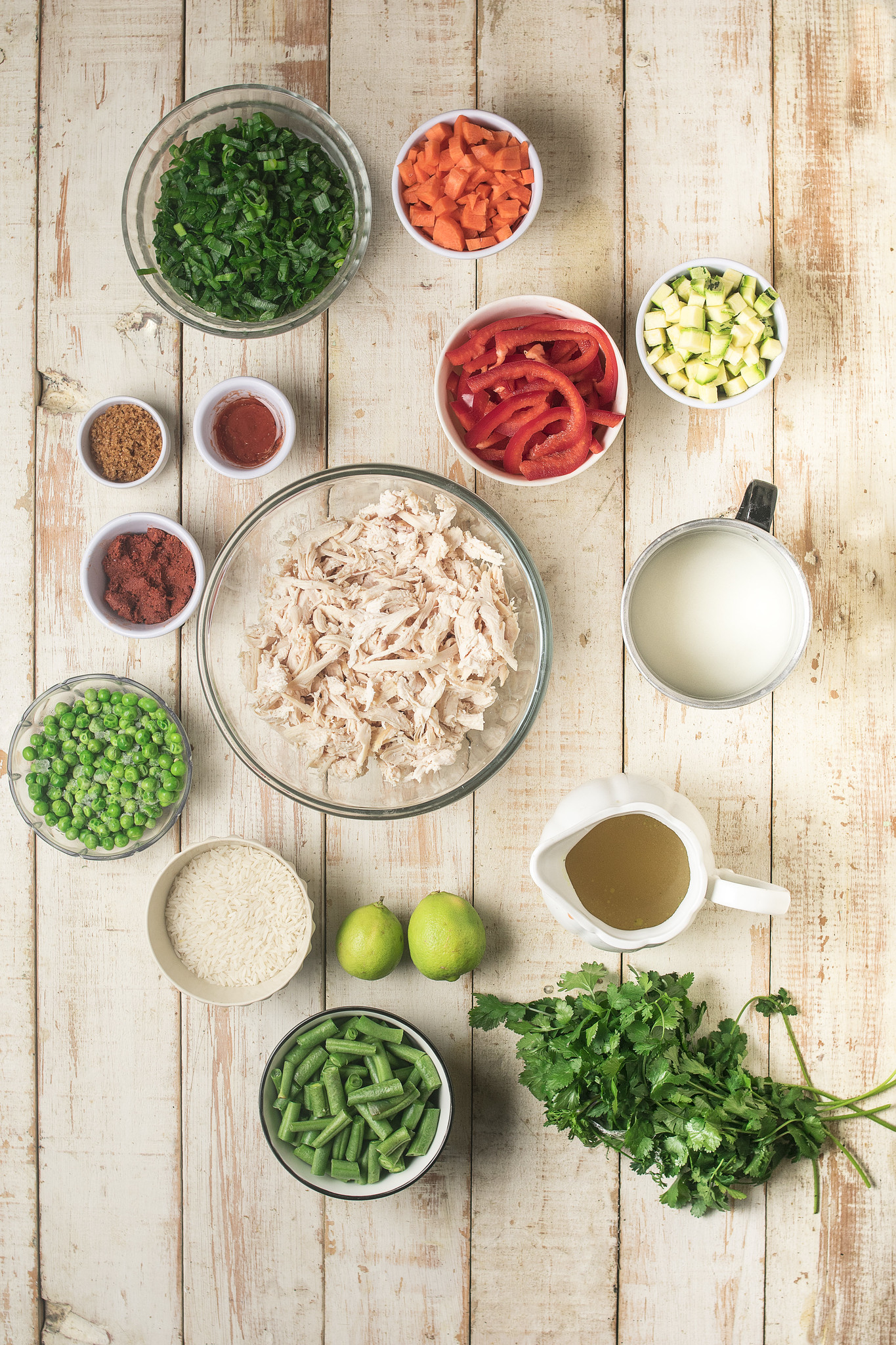 Ingredients for Curry in a Hurry including cooked chicken, red curry paste, coconut milk, vegetables, lime, coriander and jasmine rice.